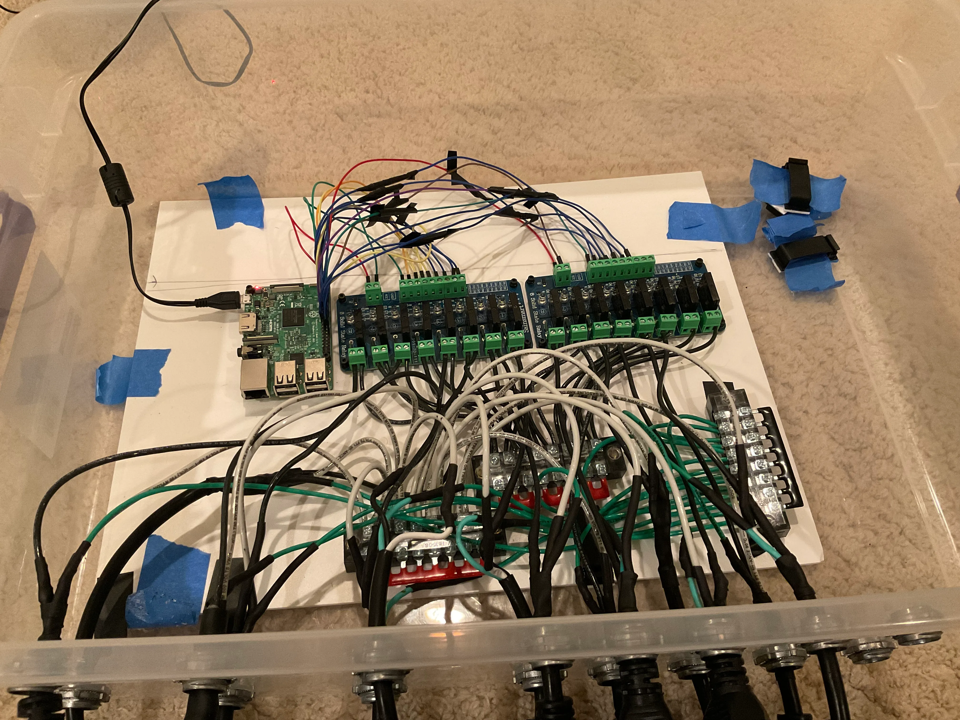 The completed box showing the Raspberry Pi and female plugs connected to the relay and power bus